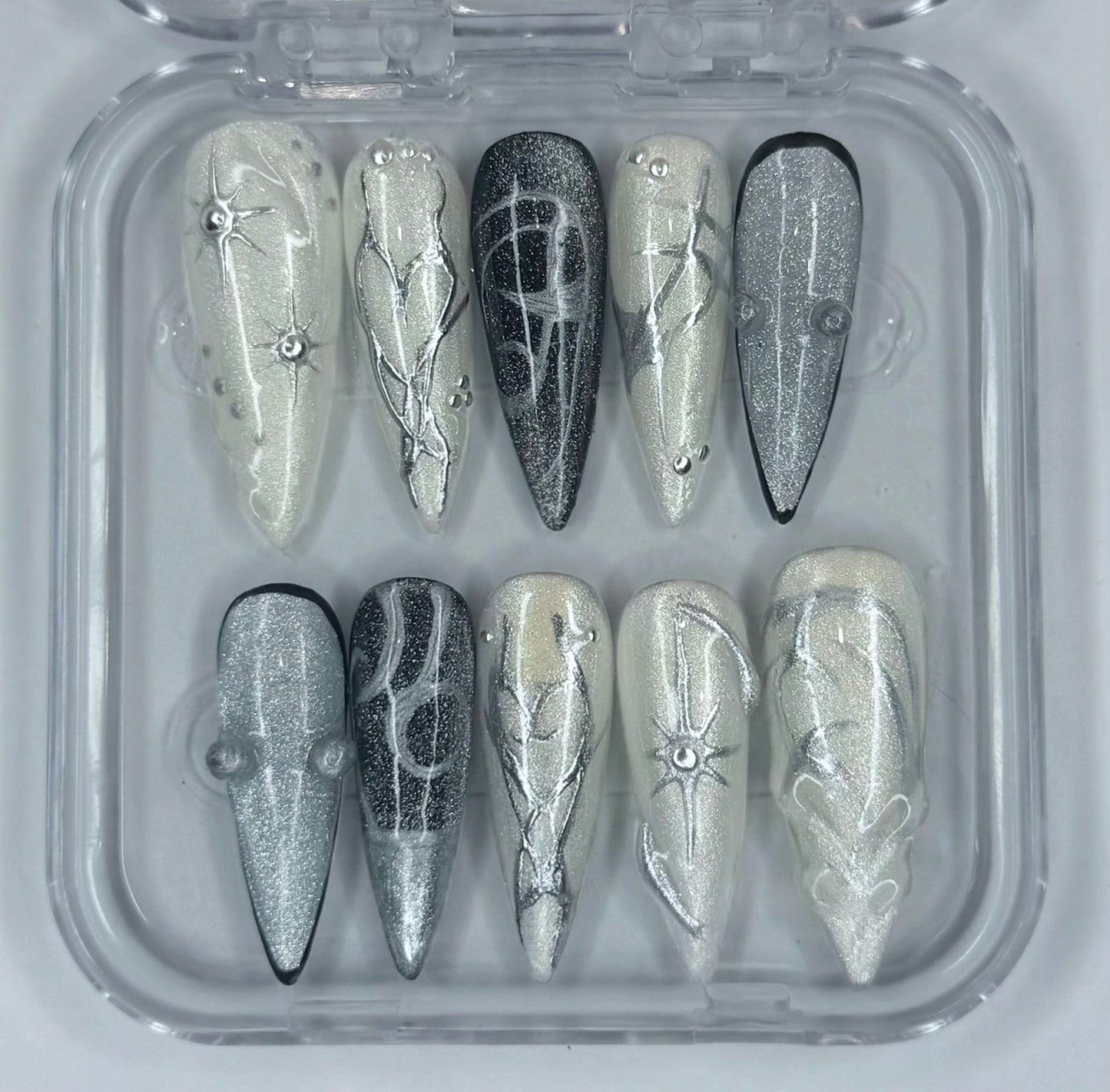 Moonlit Relic , stiletto length silver and cream chrome reusable press on nails ￼